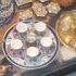 Ornate metal tray set with decorated cups