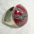 Silver ring set with a large red stone
